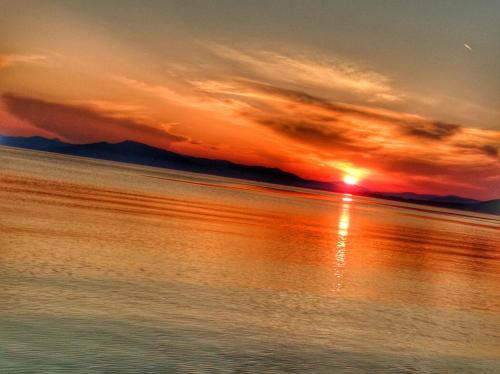 a sunset over a body of water at Seralis Pelion in Afissos