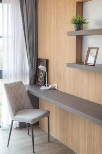 a desk with a chair in a room at Reiz - Private Residence in Chiang Mai