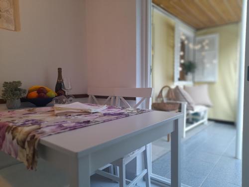 a white table with a table cloth on top of it at Rab-centar in Rab