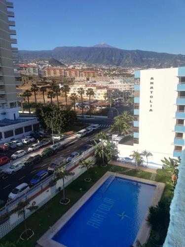 a view of the city from the balcony of a building at Anatolia playa Jardin PUERTO DE LA CRUZ Estudio in Puerto de la Cruz