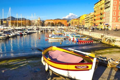 a group of boats are docked in a harbor at Pretty and quiet top floor 2 bedroom flat in the port area of Nice in Nice
