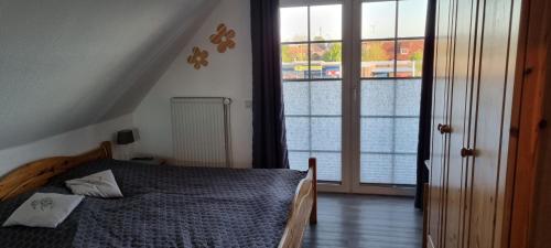 Llit o llits en una habitació de Ferienhaus Neptun