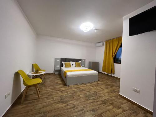 Un pat sau paturi într-o cameră la Vila Adelis