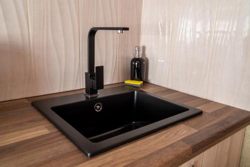 a kitchen sink with a faucet on a counter at Sielska Przystań in Sucha Rzeczka