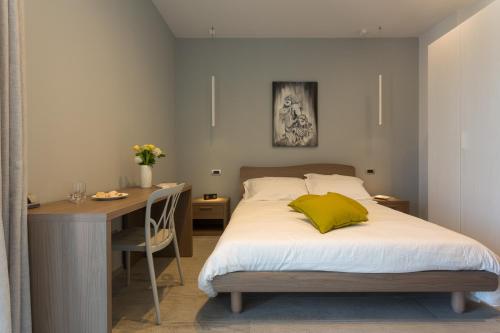 Кровать или кровати в номере Vicolo QuattroSei