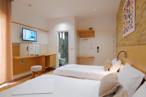 Katil atau katil-katil dalam bilik di Hotel Piccolino