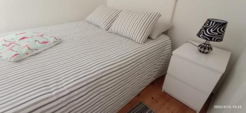 En eller flere senge i et værelse på Largo da Paz 24