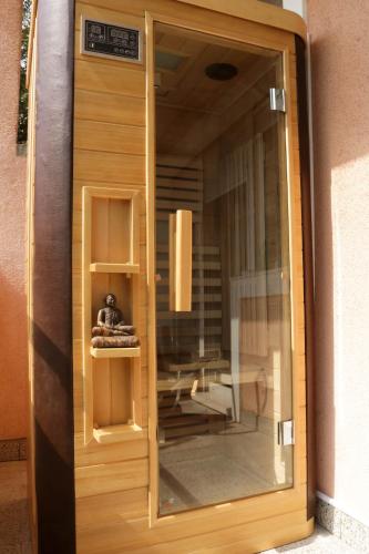 a glass door with a teddy bear sitting inside at Luxury Spalato Garden in Split