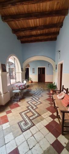 a large living room with a tile floor and a wooden ceiling at Casa Camboni-Dimora Storica Bed & Breakfast in San Vito