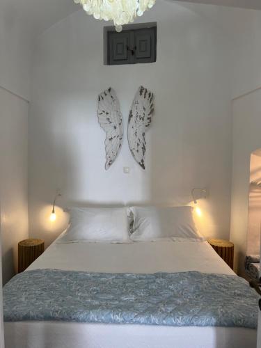 Posteľ alebo postele v izbe v ubytovaní Angels Villa Santorini