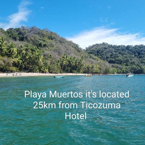 a picture of a beach with the words plague microbes its located zkm from t at Hotel Ticozuma in Montezuma