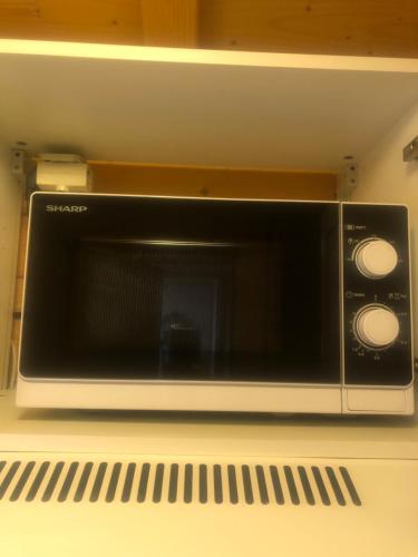 a microwave oven sitting on top of a counter at Chalet Dufour in Morzine