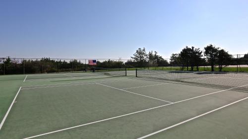 a tennis court with two tennis courts at Windward Shores in Amagansett