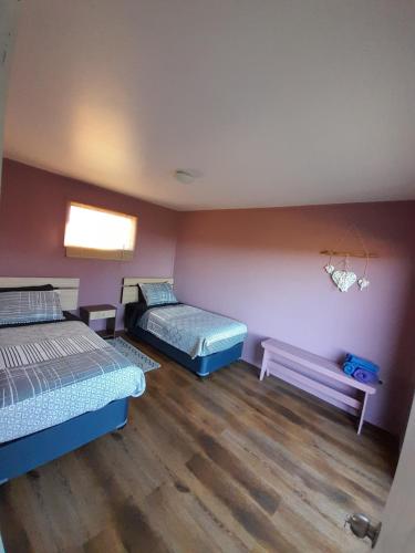 Postel nebo postele na pokoji v ubytování Casa Pascuala