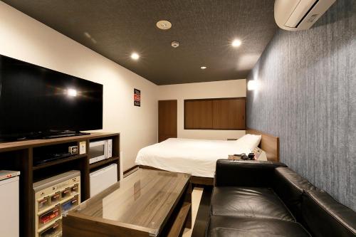 Postel nebo postele na pokoji v ubytování 555MOTEL SHONAN
