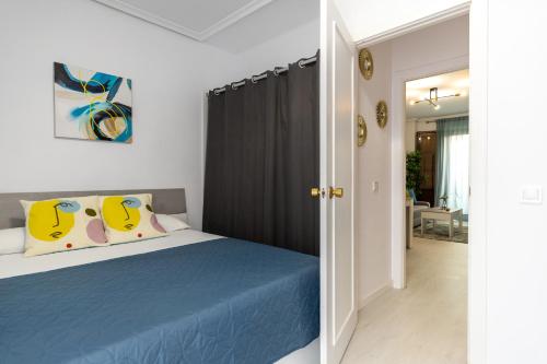 Ένα ή περισσότερα κρεβάτια σε δωμάτιο στο Santa Ana - Sol - Centro II