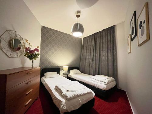 Posteľ alebo postele v izbe v ubytovaní Apartament Warszawa Centrum Helvetia Plus