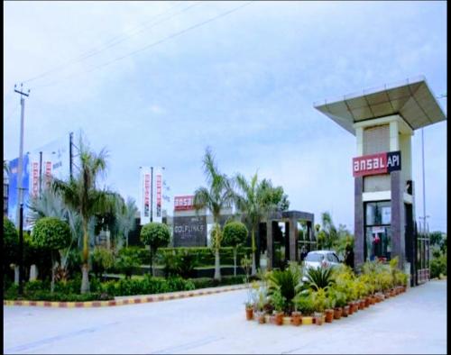 a gas station with a car parked in front of it at Boutique Stay for Family On Manali Expressway in Lāndrān
