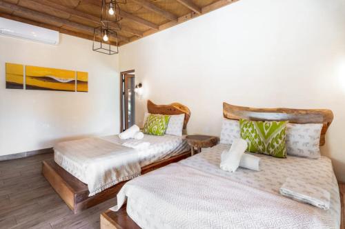 Ένα ή περισσότερα κρεβάτια σε δωμάτιο στο Zoah Surf Boutique Hotel, El Paredón