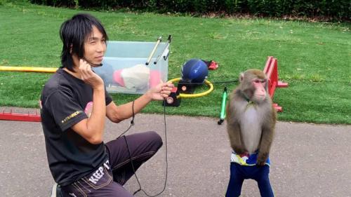 a woman holding a monkey on a string at Toyoko Inn Gumma Isesaki Ekimae in Isesaki