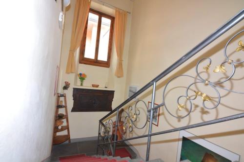 a staircase in a house with a glass railing at Albergo Casa Al Sole in Greve in Chianti
