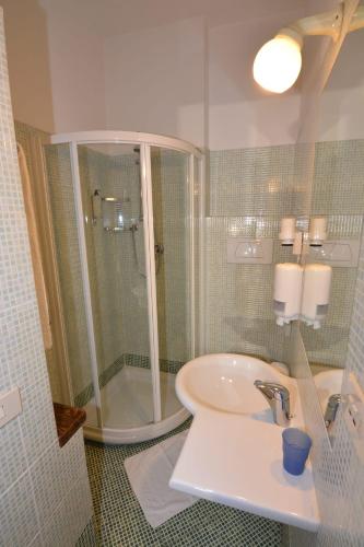a bathroom with a shower and a sink at Albergo Casa Al Sole in Greve in Chianti