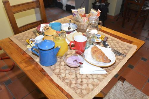 a table with a breakfast of food on it at Albergo Casa Al Sole in Greve in Chianti