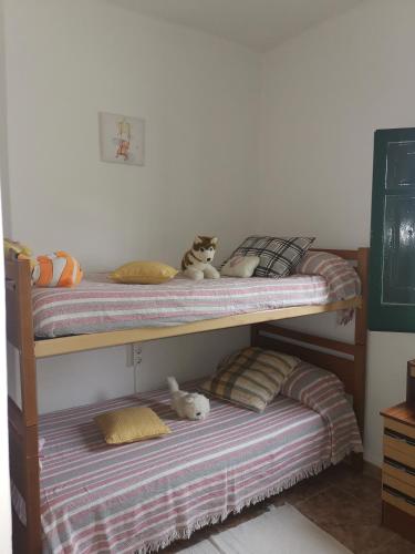 two bunk beds with stuffed animals sitting on them at Casa Rural Masia d'en Gall in L'Aldea
