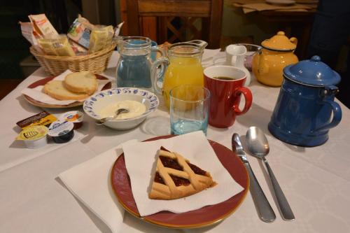 a table with a plate of food on a table at Albergo Casa Al Sole in Greve in Chianti