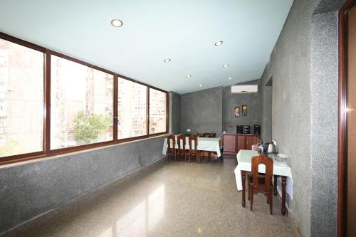 a kitchen and dining room with a table and chairs at Guest house YEREVAN in Yerevan