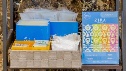 a shelf full of boxes and papers on a table at Toyoko Inn Hitachi Ekimae in Hitachi