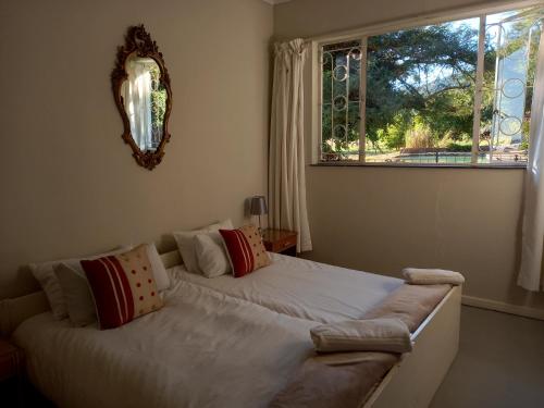 a bedroom with a large bed with a window at Valhalla Ranch in Dundee