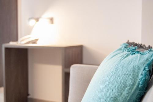 Postel nebo postele na pokoji v ubytování Hotel Quatre Llunes