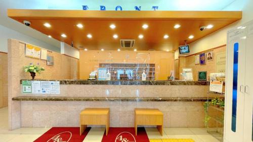 a fast food restaurant with two stools and a counter at Toyoko Inn Yokohama Shinkoyasu Ekimae in Yokohama