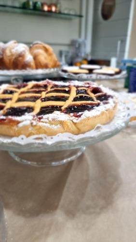 a pie on a glass plate on a table at Residence Margherita in Cattolica