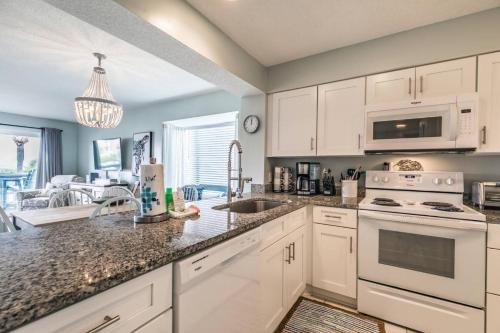 a kitchen with white cabinets and a counter top at Harbor Island M118 in Oceanmarsh Subdivision