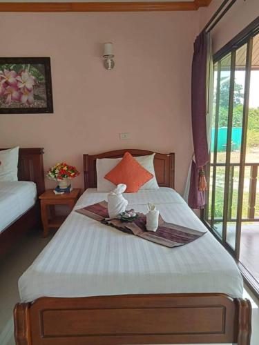 Postel nebo postele na pokoji v ubytování Pawarisa Resort