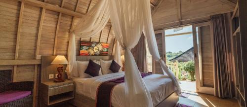 A bed or beds in a room at Akusara Jungle Resort And Spa