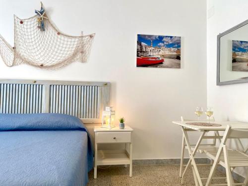 Ліжко або ліжка в номері Dimore Aria di Mare - Puglia Mia Apartments