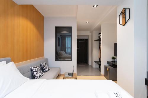 Cama o camas de una habitación en โรงแรมอินฟินิทเกษตร