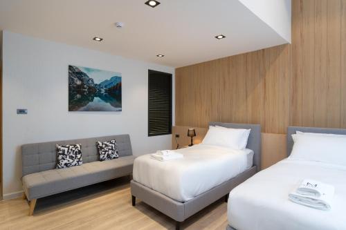 Cama o camas de una habitación en โรงแรมอินฟินิทเกษตร