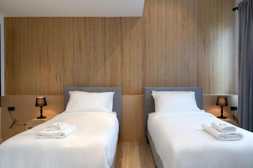 Cama o camas de una habitación en โรงแรมอินฟินิทเกษตร