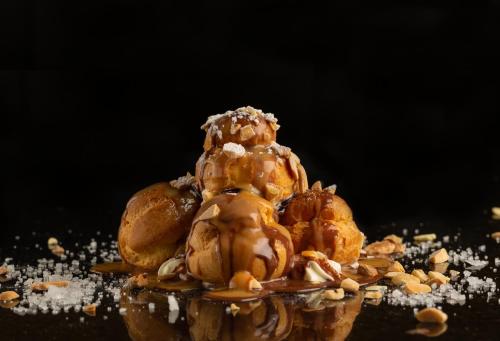 a pile of food sitting on top of a table at InterContinental Al Khobar by IHG in Al Khobar