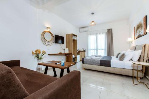 Postel nebo postele na pokoji v ubytování Deluxe Suites