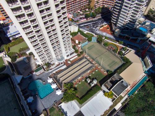 an overhead view of a tennis court in a city at Novotel Surfers Paradise in Gold Coast