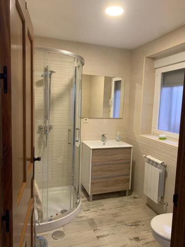 a bathroom with a shower and a sink at Casa de los Maestros in Rágama