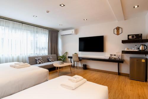 Cama o camas de una habitación en โรงแรมอินฟินิทเกษตร