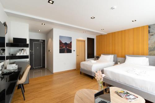 Cama o camas de una habitación en โรงแรมอินฟินิทเกษตร