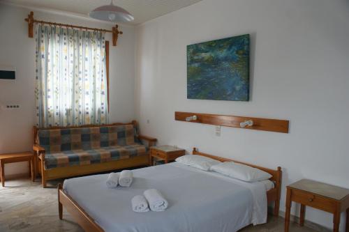 Postel nebo postele na pokoji v ubytování Hotel Eleftheria