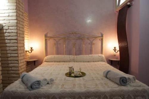 a bedroom with a large bed with a white bedspread at B&B Casa dei Lillà in Santeramo in Colle